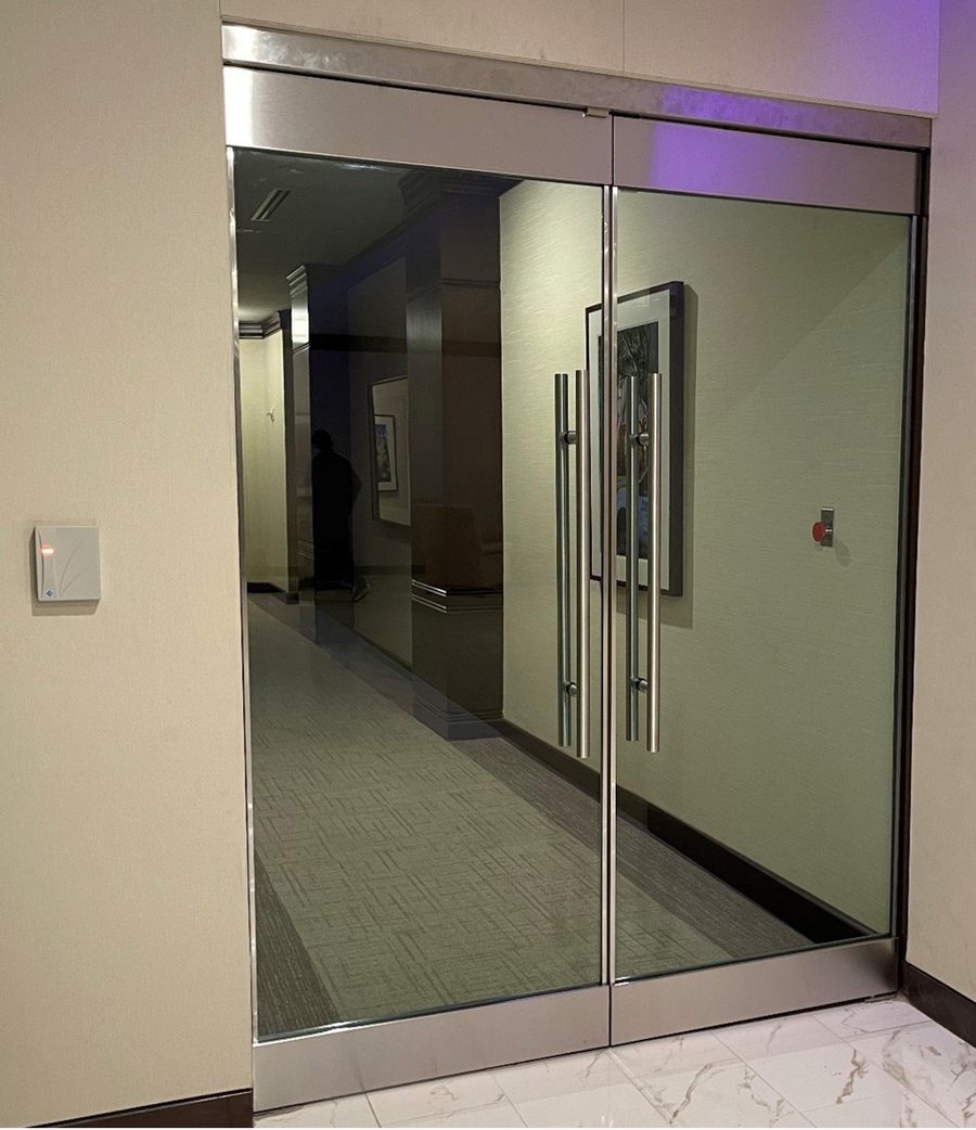 A protected interior entry with glazed doors in a steel frame