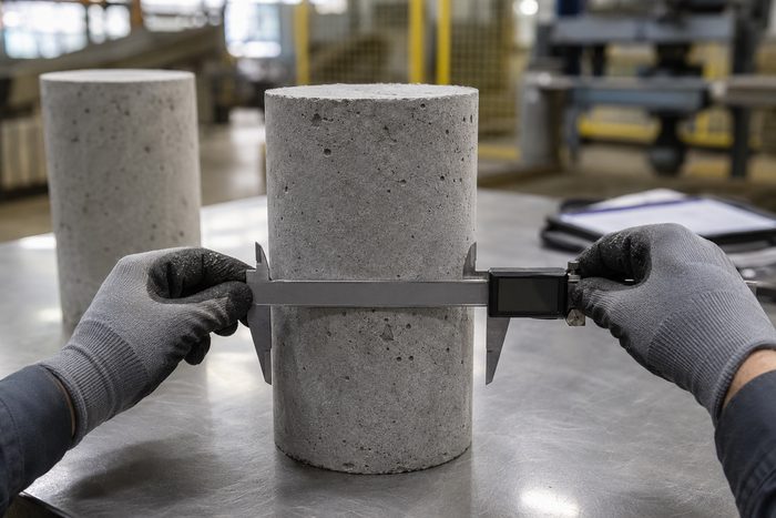 Quality-control measurement of a cast concrete test cylinder